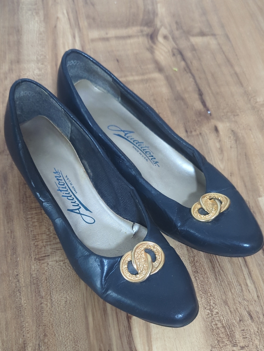 Auditions Black Leather Flats with Gold Medallion